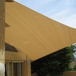 Domestic shade sail covering a courtyard
